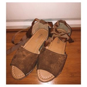 Brown Ribbon-Tie Moccasin Sandals.